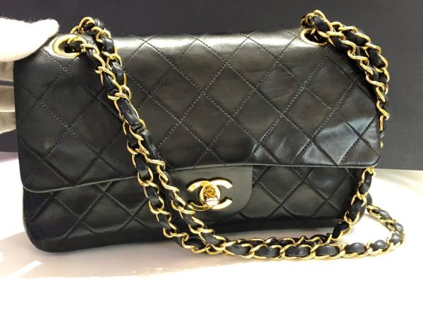 black and gold chanel handbag white