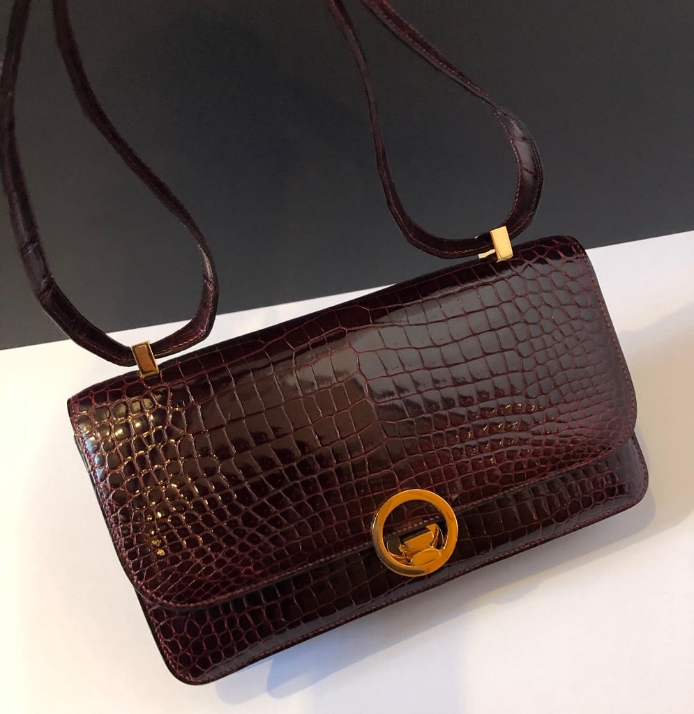 HERMES COCKTAIL SHOULDER BAG, burgundy box calf leather, flap front with an  oval closure that clips into the clasp, front slot section and few others  one with snap closure, gold tone hardware