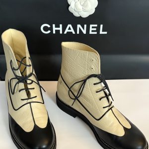 chanel cc logo cream black lambskin lace up combat boots