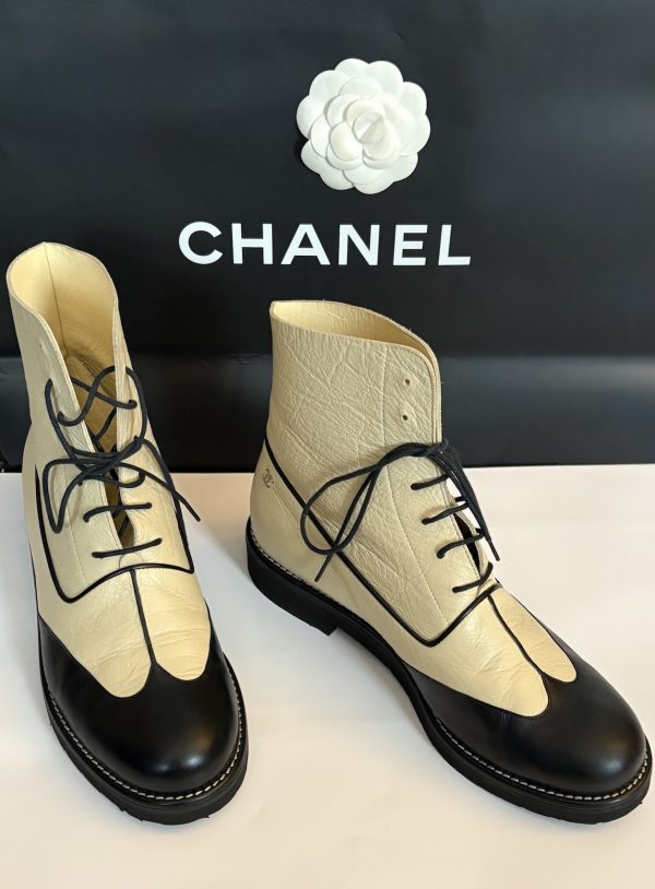 chanel cc logo cream black lambskin lace up combat boots