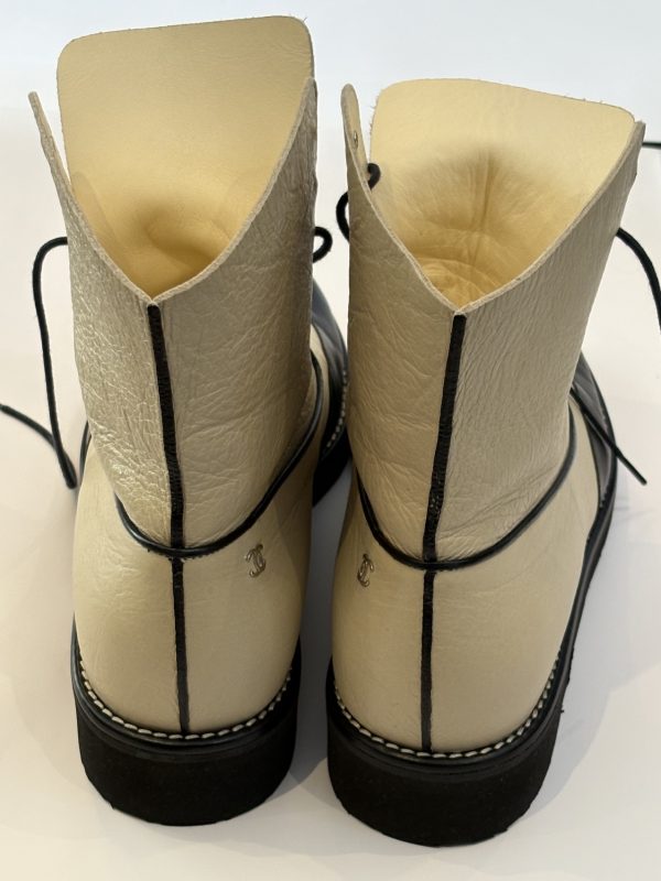 chanel cc logo cream black lambskin lace up combat boots