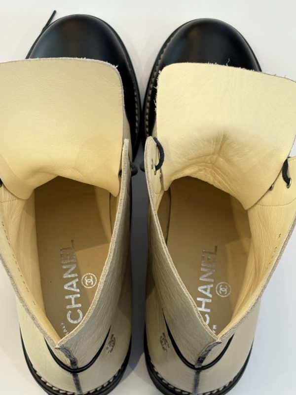 chanel cc logo cream black lambskin lace up combat boots