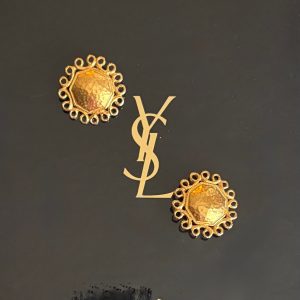 yves saint laurent vintage hammered gold tone sun face earrings c.1980s