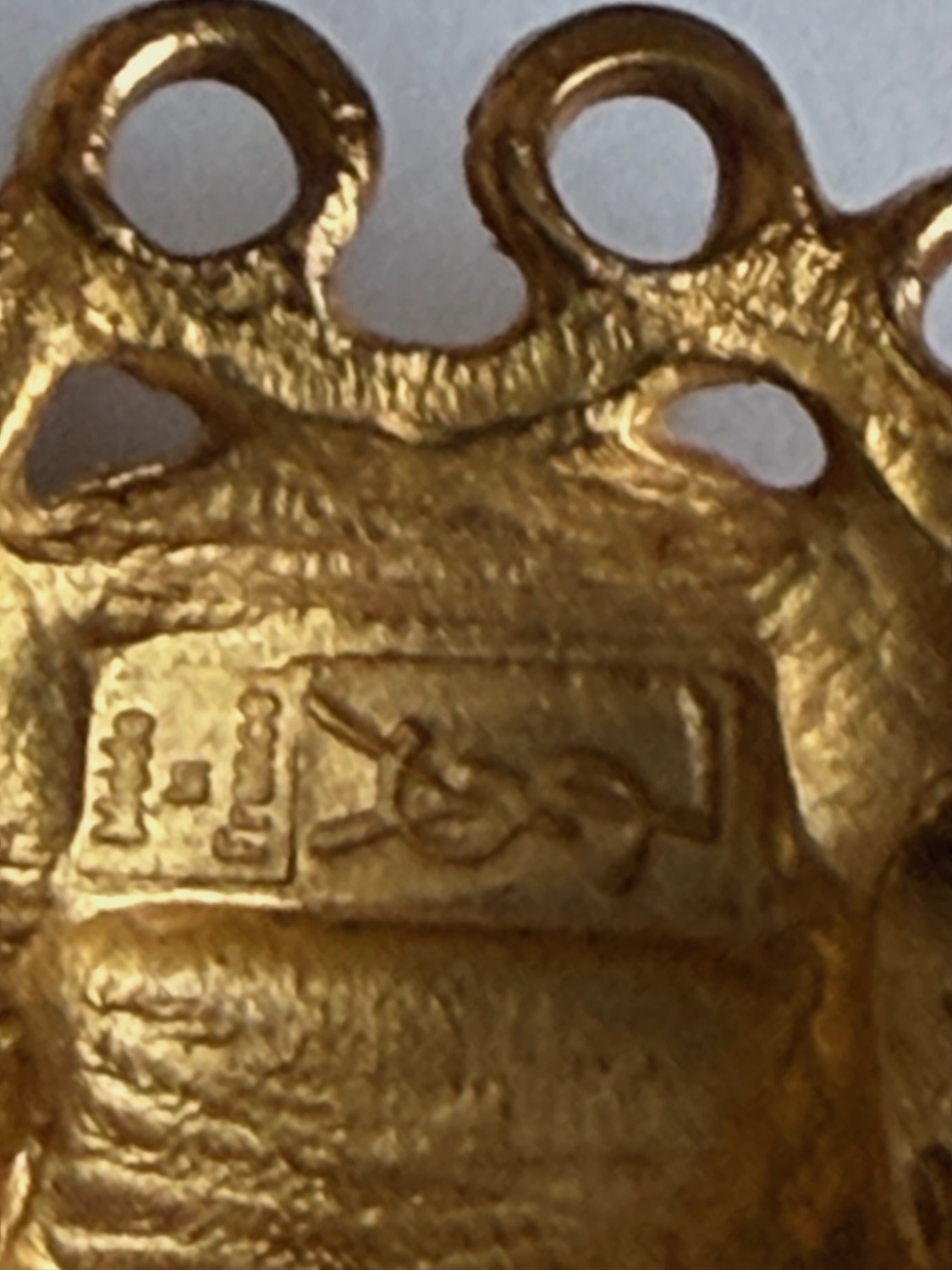 yves saint laurent vintage hammered gold tone sun face earrings c.1980s