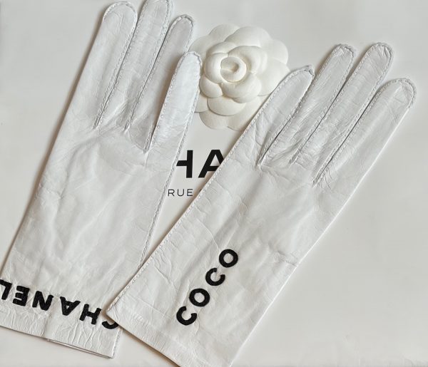 chanel vintage white kidskin gloves with black coco chanel logo c.1990s