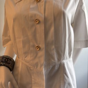 1980s chanel vintage white pleated v cut blouse with chanel jewel buttons