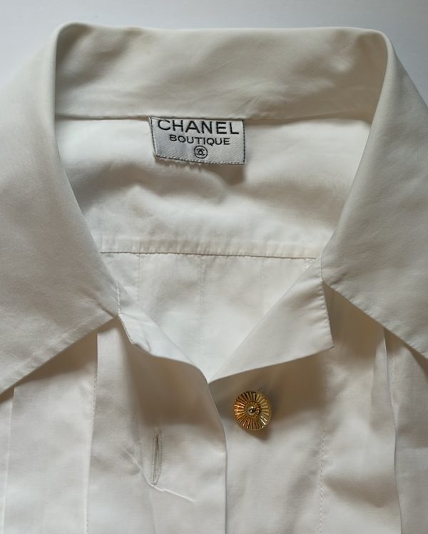 1980s chanel vintage white pleated v cut blouse with chanel jewel buttons