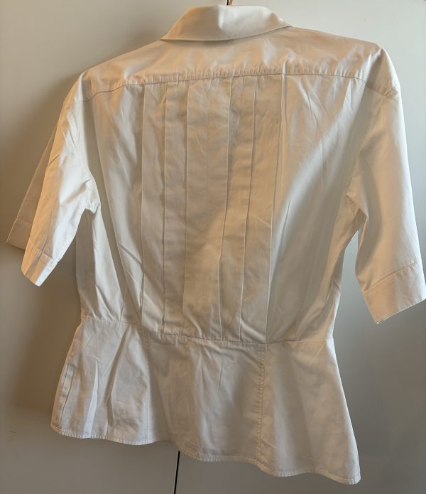 1980s chanel vintage white pleated v cut blouse with chanel jewel buttons