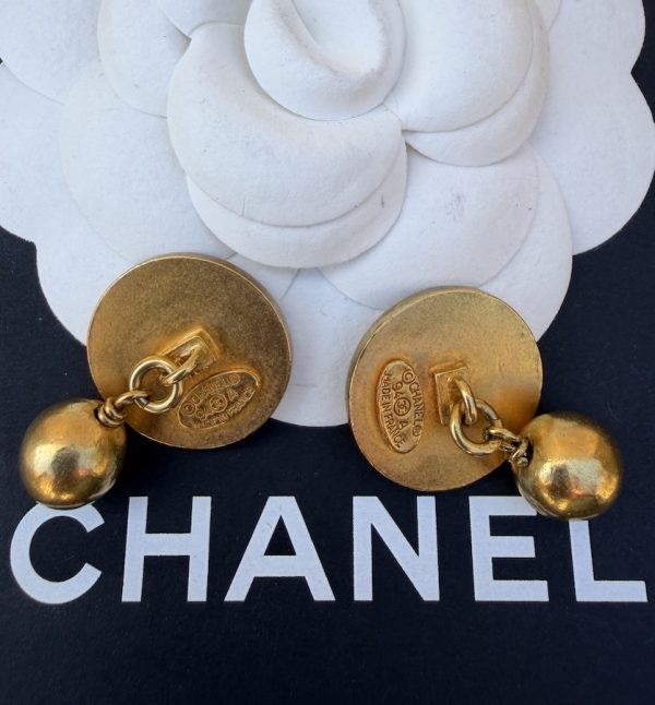 chanel vintage cc logo round disk gold and black cufflinks unisex 1994